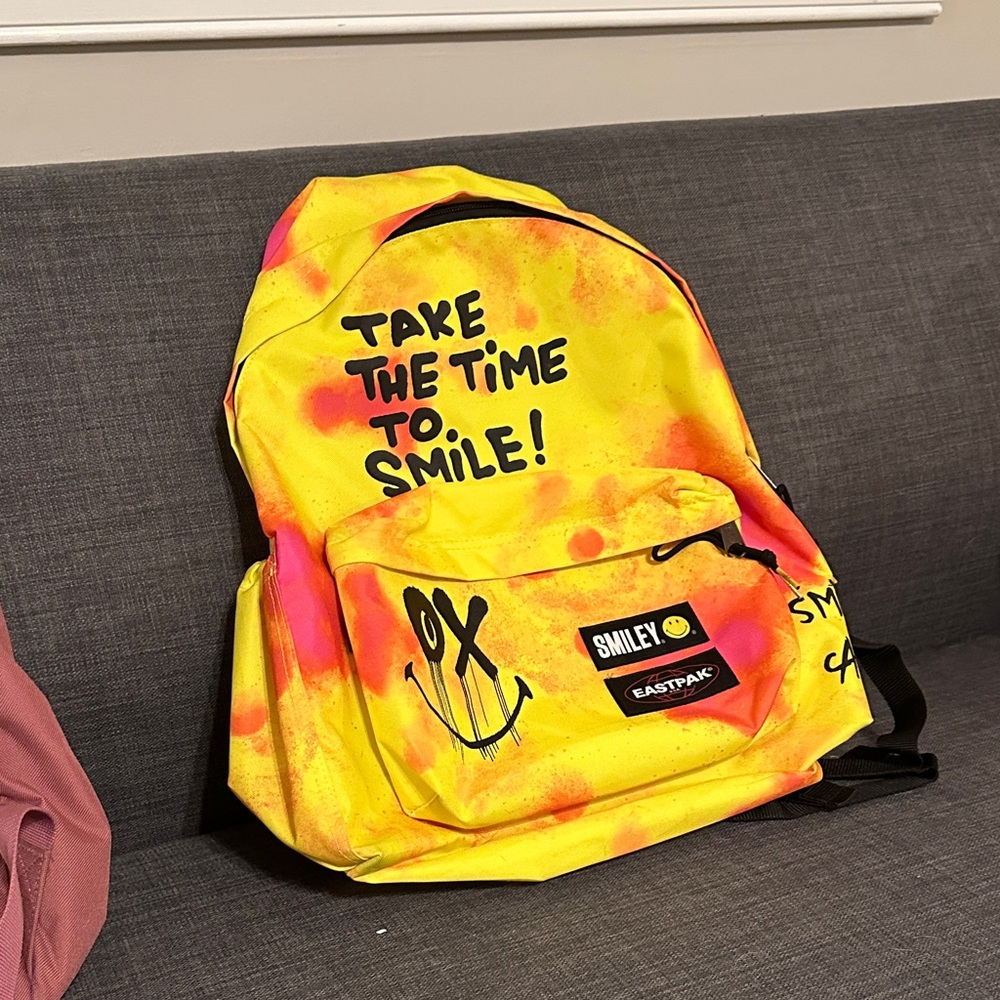 Eastpak Yellow and Orange Smiley Backpack